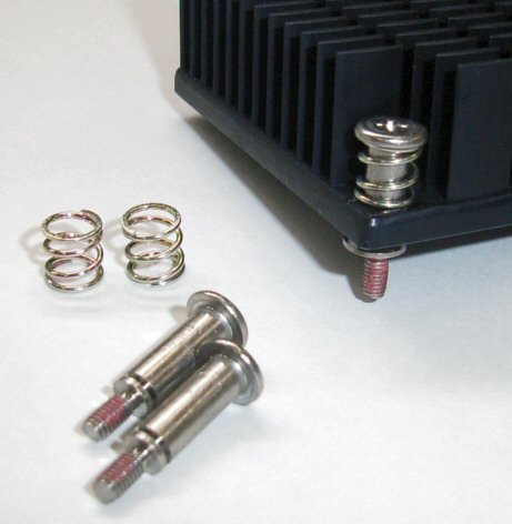 Heat sink with spring and shoulder screw